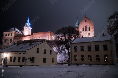 Oslo, Norway. Inside the walls of the Akershus Fortress on a cold snowy winter night. Next to a military base. photo