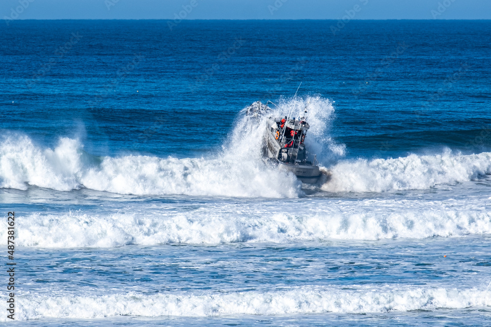 Depoe Bay Coast guard boat in the surf close to shore