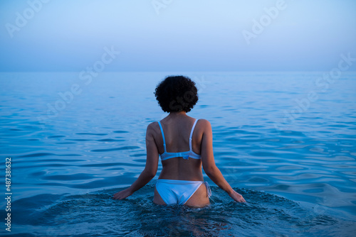 woman swimming in bikini