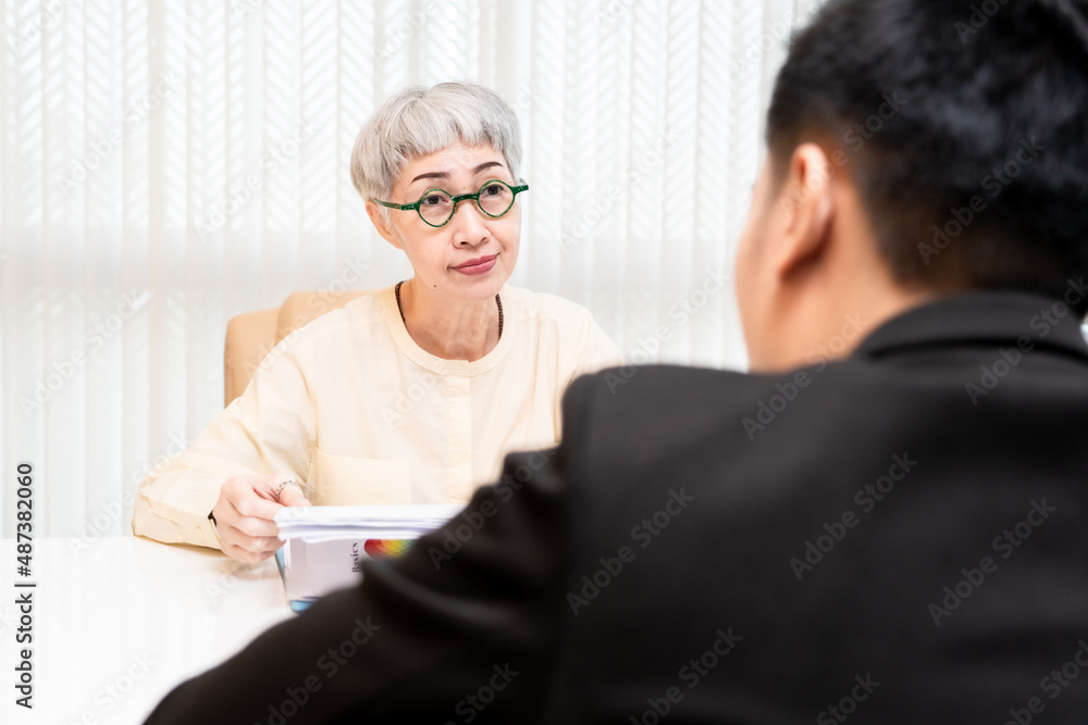 male job applicant Asians are Interview with an elderly Asian woman manager in an office in a friendly atmosphere. The interviewees were very satisfied with the qualifications of the job applicants. male job applicant Asians are Interview with an elderly Asian woman manager in an office in a friendly atmosphere. The interviewees were very satisfied with the qualifications of the job applicants.