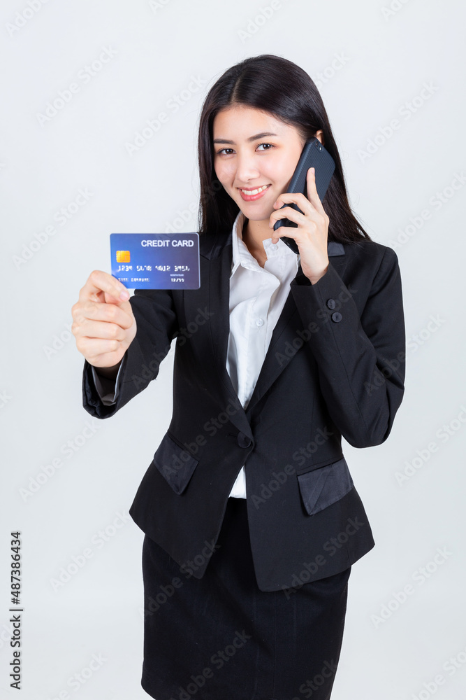 asian business woman wearing office clothing hands show credit card and use smart phone mobile, credits card and payment concept. asian business woman wearing office clothing hands show credit card and use smart phone mobile, credits card and payment concept.