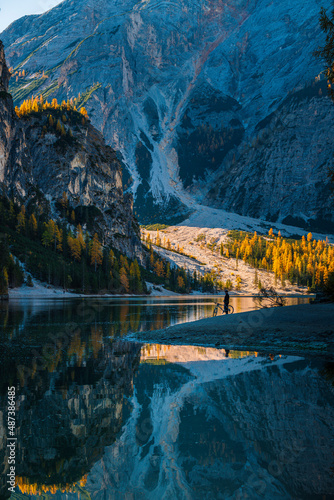 Autumn and golden reflections on Lake Braies. Park of the Dolomites.