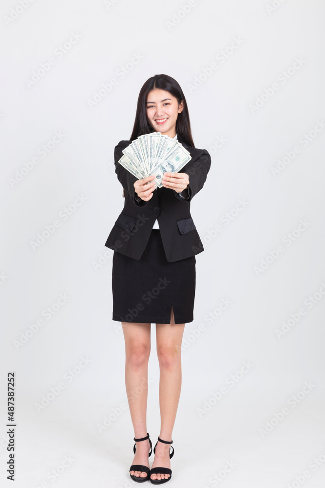 confident portrait beautiful asian woman successful wearing office clothing with US dollars money in hand feeling happy and smile, bankruptcy economic financial concept. confident portrait beautiful asian woman successful wearing office clothing with US dollars money in hand feeling happy and smile, bankruptcy economic financial concept.