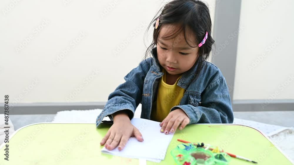 Asian girls having fun painting and painting at home. Asian girls having fun painting and painting at home.