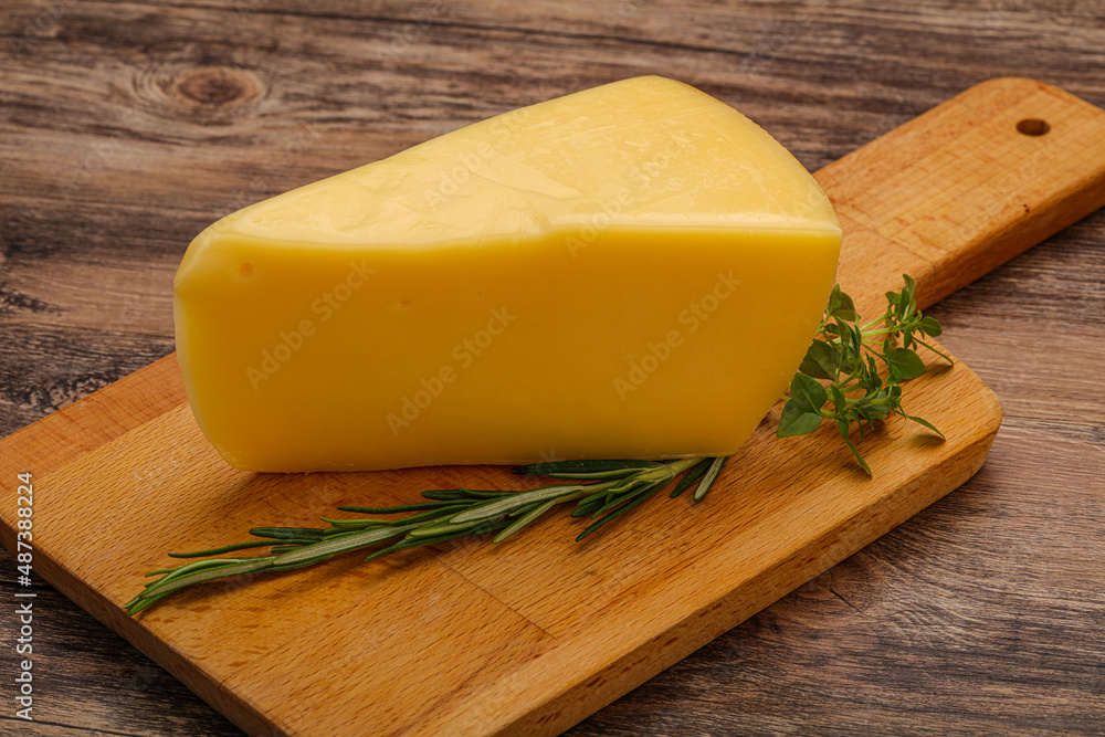 Hard cheese piece served rosemary Hard cheese piece served rosemary