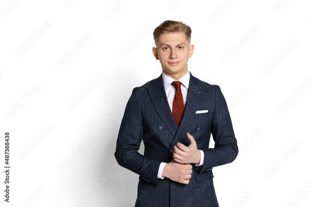Half-length portrait of handsome young businessman, student, diplomat looking at camera isolated on white studio background. Human emotions, facial expression concept. Half-length portrait of handsome young businessman, student, diplomat looking at camera isolated on white studio background. Human emotions, facial expression concept.