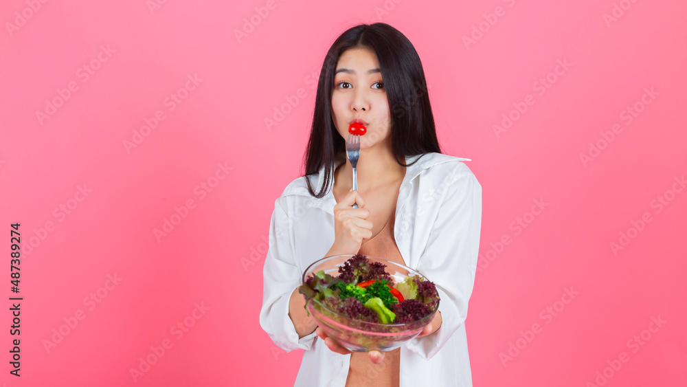 asian woman eating healthy fresh vegetable with copy space, Beauty healthcare diet and vegetarian lifestyle concept. asian woman eating healthy fresh vegetable with copy space, Beauty healthcare diet and vegetarian lifestyle concept.