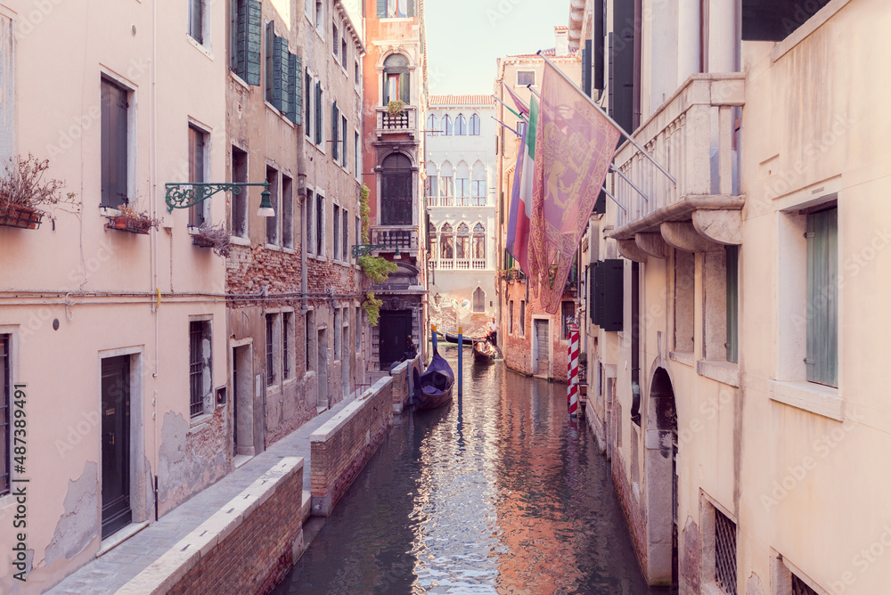 narrow canal in Venice with gandola