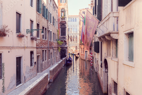 narrow canal in Venice with gandola
