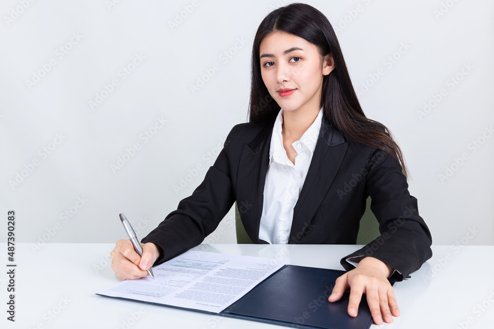 asian business woman working in office with documents. asian business woman working in office with documents.