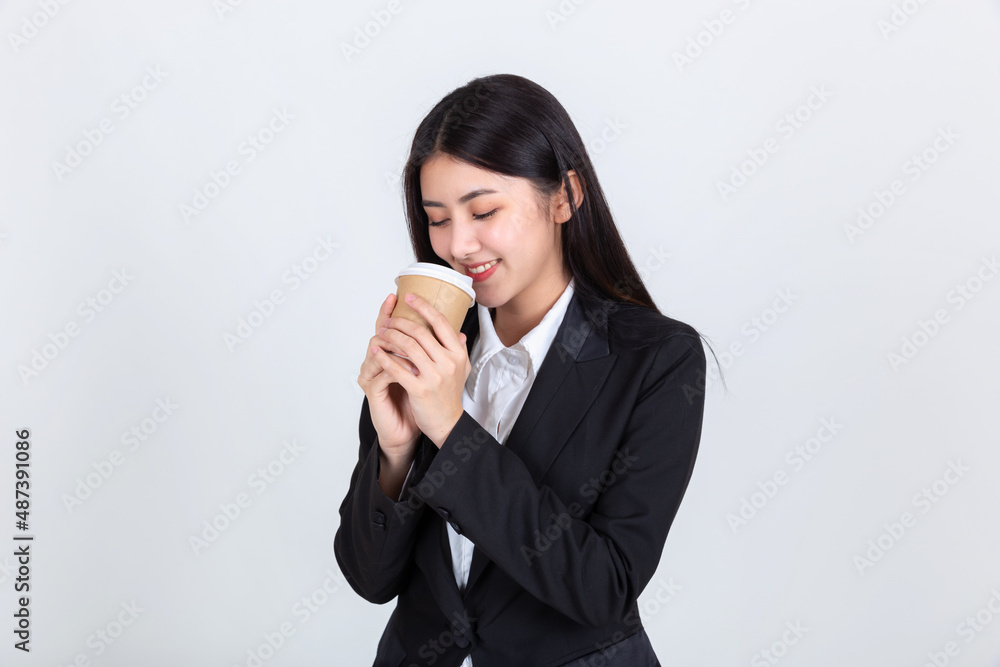 Entrepreneur pretty young asian woman ,Beautiful attractive asian business woman wearing black suit smile feeling happy holding coffee cup with copy space for your promotional or text. Entrepreneur pretty young asian woman ,Beautiful attractive asian business woman wearing black suit smile feeling happy holding coffee cup with copy space for your promotional or text.