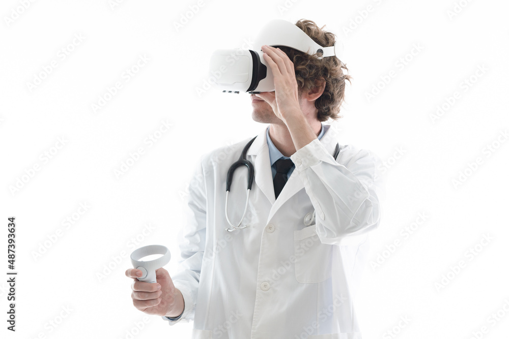 A doctor using VR headset and joystick on isolated white background. Concept virtual reality medical healthcare service technology. A doctor using VR headset and joystick on isolated white background. Concept virtual reality medical healthcare service technology.