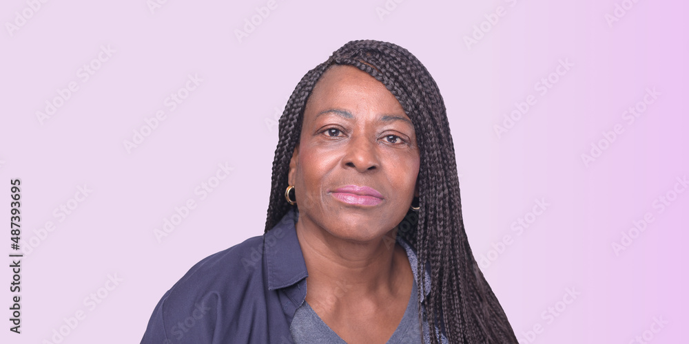 woman with long plaited hair on pink background woman with long plaited hair on pink background