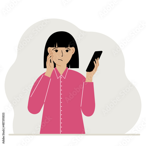 A woman looks at a mobile phone. A woman looks sadly at the phone he holds in his hand. Vector