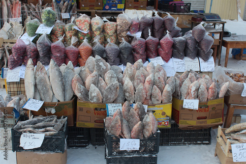 Frozen fish and berries, winter street market in Yakutsk, Sakha, Yakutia photo