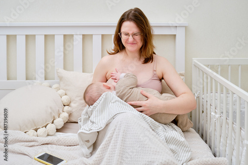 Картината върху платно Pain and problems in a woman while breastfeeding a baby