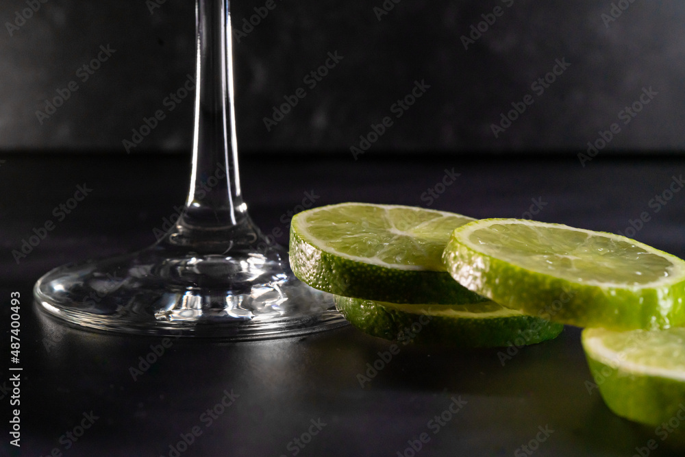 Samolepka Up close bottom of martini glass with limes