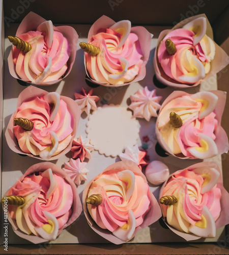 Delivery box with sweet unicorn cupcakes dessert