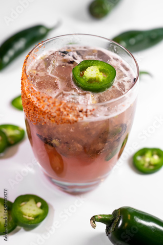 Pink cocktail with spicy jalapenos