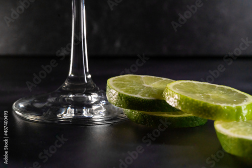 Принти на полотні Up close bottom of martini glass with limes