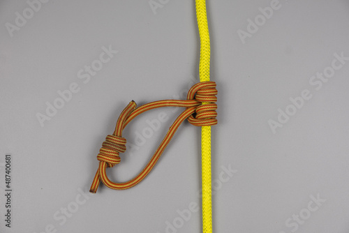 Rope knot on gray background