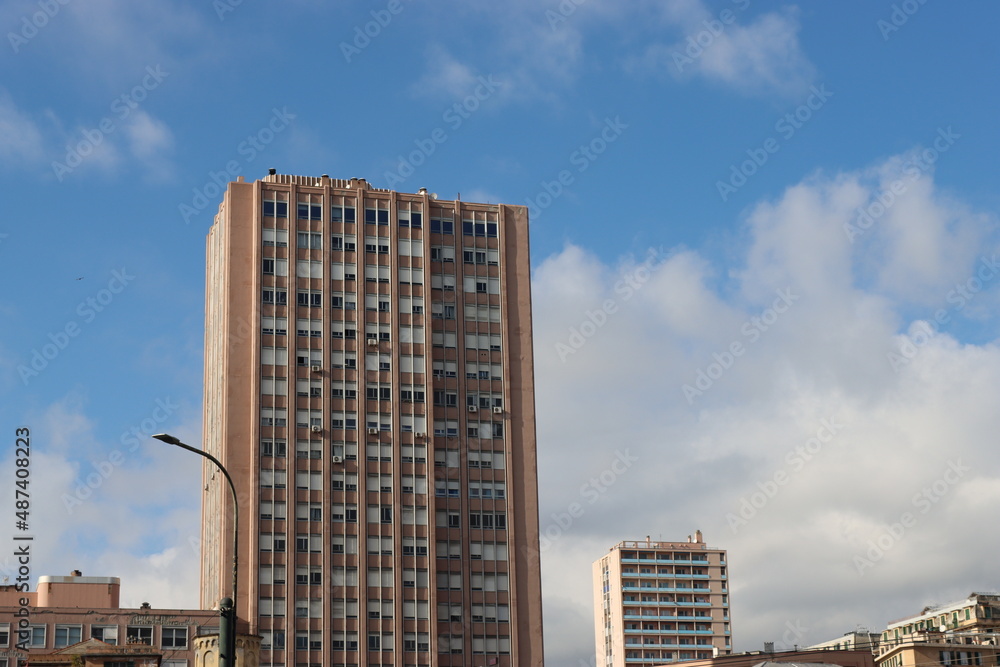 Genova, Italy - January 29, 2022: Beautiful modern high-rise buildings against the sky. 3d illustration on the theme of business success and technology. clouds reflection on the mirror. Genova, Italy - January 29, 2022: Beautiful modern high-rise buildings against the sky. 3d illustration on the theme of business success and technology. clouds reflection on the mirror.