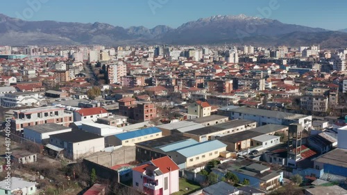 Wallpaper Mural Shkoder Albania cityscape - skyline of a city, with buildings and houses, surrounded by high hills and mountains. Aerial drone view of Shkodra (Skadar) on a sunny day with clear blue sky. Torontodigital.ca