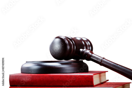 Abstract photo with wooden gavel and red book with codes on white background as symbol of of rule of law with judge\'s gavel, justice with judge\'s gavel and force of law with udge\'s gavel