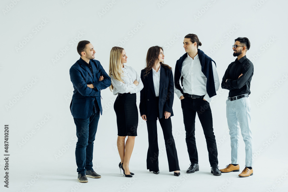 Obraz premium Happy business team smiling isolated over a white background