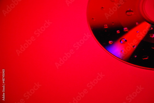 CD disc in red light