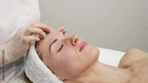 Female doctor exam person skin. Female patient consultation. Dermatology aesthetic surgery preparation. Spa salon facial treatment video. Luxury hospital check. Rejuvenation touch. Hands in gloves