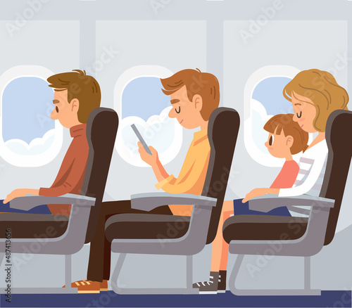 Airplane passengers sitting on their seats at cabin on a plane flight. flying by plane