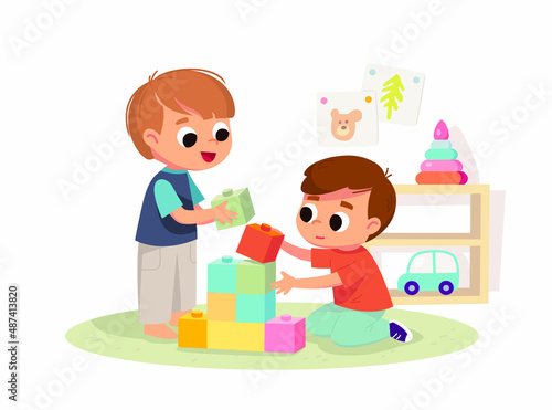 Two boys play together. Educational toys. Educational toys. Children playing designer cubes, developing constructor set.