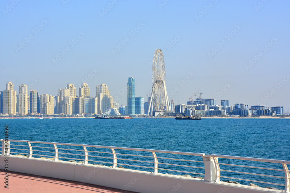 Naklejka premium Dubai, UAE - View at skyscrapers and Dubai Eye from man-made, artificial Palm Jumeirah Island