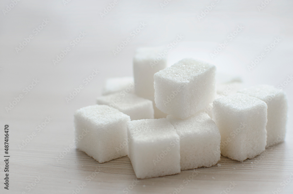 close up of sugar cubes On a light neutral background. Place for text, copyspace. close up of sugar cubes On a light neutral background. Place for text, copyspace.