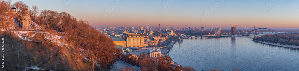 View at sunrise on the Saint Vladimir Monument, the Dnieper River and the Podolsky district of the city of Kiev.