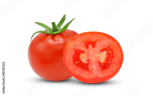 Whole, half tomato isolated on white background.