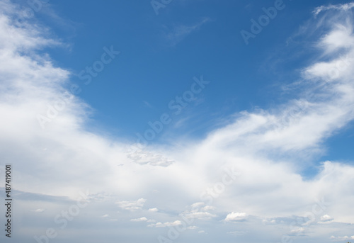Snow-white different types of clouds surround the background of the blue sky © Алексей Вяткин
