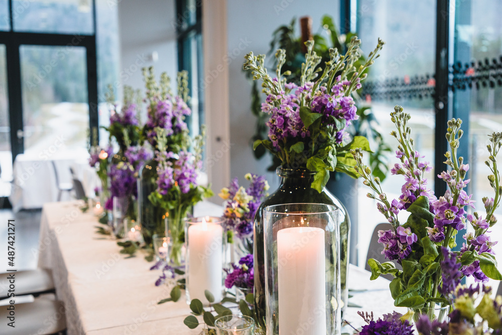 Purple and violet wedding flower arrangements, made out of carnations lisianthus and matthiola flowers. 