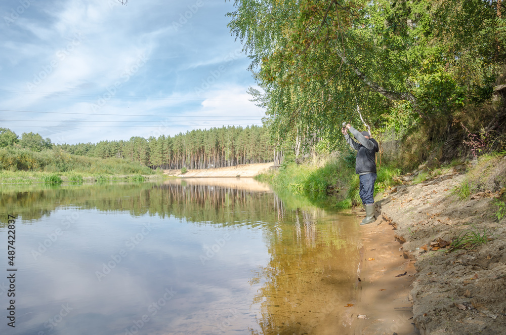 Fisherman on the bank of a beautiful river.