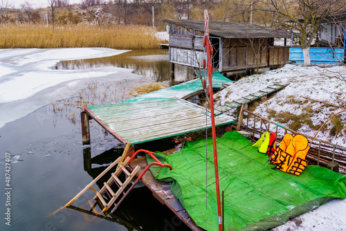 A pier or jetty on the bank of a river or body of water. Background with copy space photo