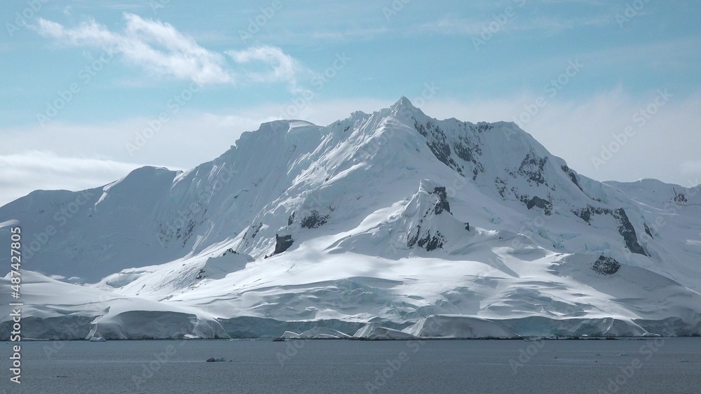 Icebergs in the Arctic. The result of global warming and climate change on our planet. Nature and landscapes of Greenland. Disko bay. Summer Midnight Sun and icebergs. Big blue ice in icefjord. Icebergs in the Arctic. The result of global warming and climate change on our planet. Nature and landscapes of Greenland. Disko bay. Summer Midnight Sun and icebergs. Big blue ice in icefjord.
