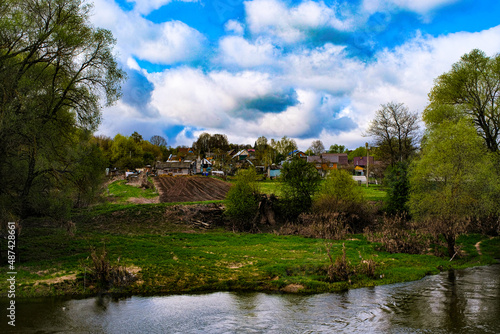 Landscape with the image of a russian summer river countryside