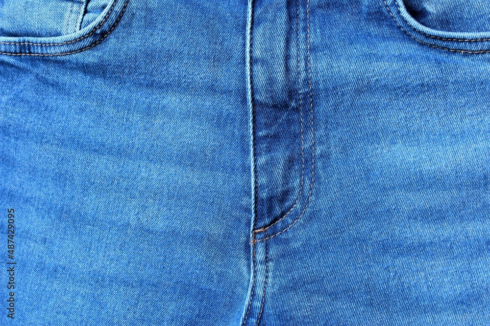 Close up frontside of blue jean trousers photo texture background Close up frontside of blue jean trousers photo texture background
