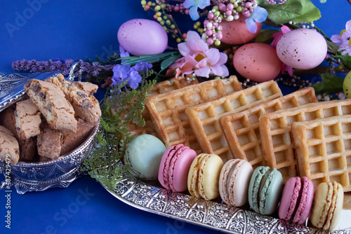 macarons and various sweet treats photographed with Easter decor