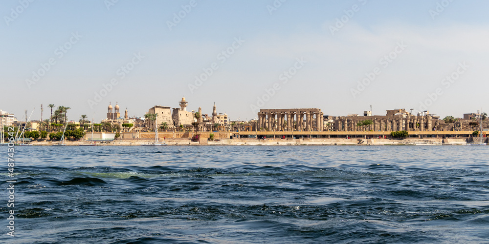 Luxor Temple is a large Ancient Egyptian temple complex on east bank of Nile river in Luxor. View from Nile river