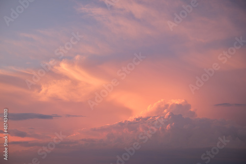 Colorful evening landscape with soft pastel coloured cloudscape on watercolor tinted sunset sky. Abstract nature background © bilanol