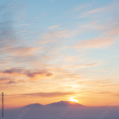 Sunset over the tundra and snow-capped mountains. Winter arctic landscape. Cold winter weather. Frosty fog over the winter tundra. The nature of Chukotka and polar Siberia. Far North of Russia, Arctic © Andrei Stepanov