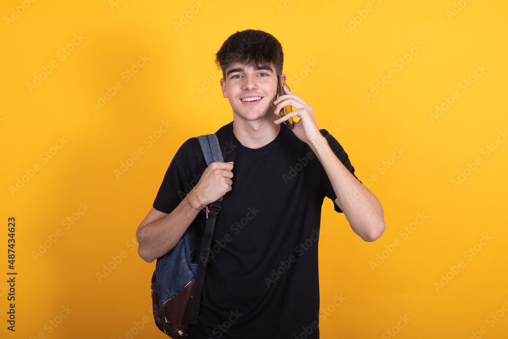 isolated student talking on the mobile phone or cellular isolated student talking on the mobile phone or cellular