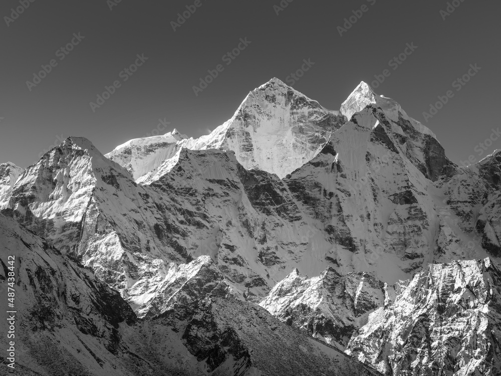 View to snow peaks of Himalaya in sunny day in Nepal and in monochrome style 